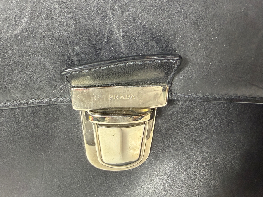 Just Added - Vintage Prada Black Smooth Calfskin Leather Flap-Over Briefcase Featuring Dual Silver-Tone Tuck Lock Closures And Single Top Handle 17.5'W X 14'H [Photo 3]