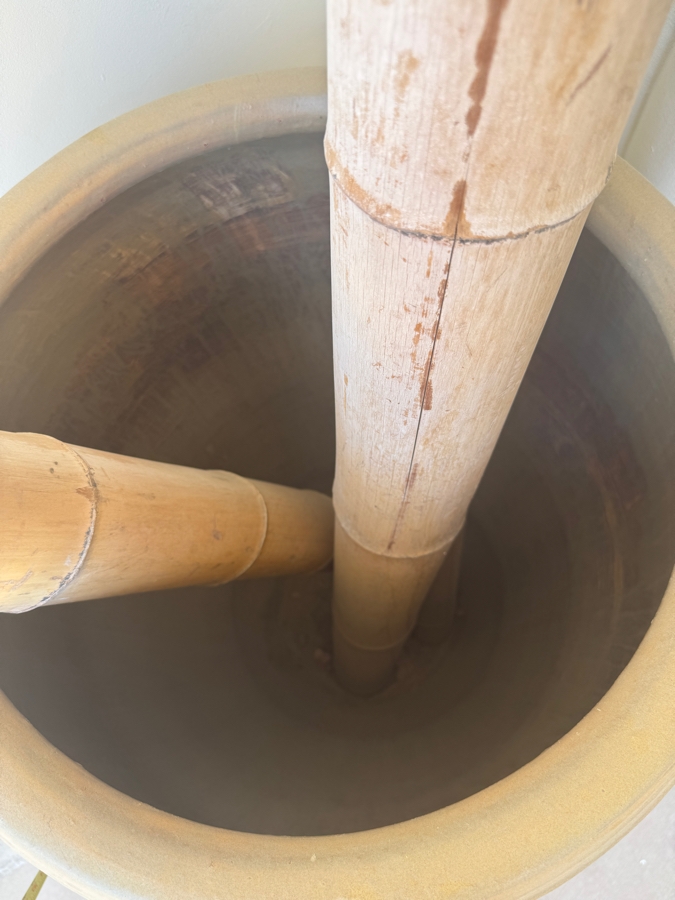 Large Tapered Tempayan Terracotta Urn Floor Vase In Weathered Ochre Patina Featuring Three Tall Oversized Natural Bamboo Decorative Poles Vase: 24'W X 43'H Bamboo: 120'H [Photo 7]