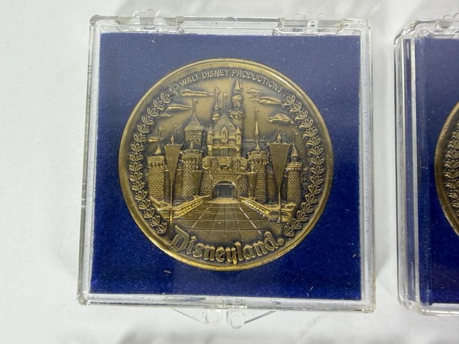 (6) Vintage Walt Disney Productions Bronze Disneyland Commemorative Medallion Featuring Sleeping Beauty Castle And Five Themed Lands In Plastic Display Cases [Photo 2]