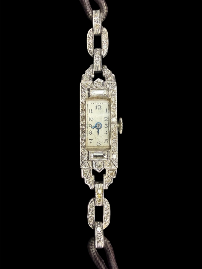 Platinum (90%) / Iridium (10%) Swiss Watch Set With (54) 1.25mm Single Cut Natural Diamonds And (2) 4 x 1.5mm Baguette Natural Diamonds Est. .68cttw Working 11.9g Retails $3,400