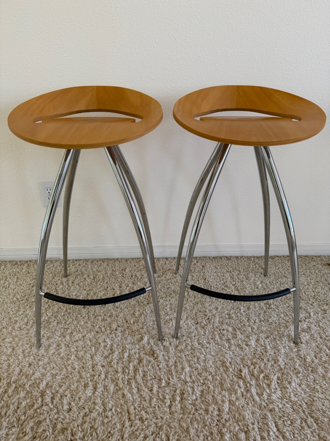 Pair Of Magis Lyra Bar Stools Designed By Design Group Italia With A Scooped Beech Wood Seat And Curved Chrome Legs 27' Seat Height [Photo 2]