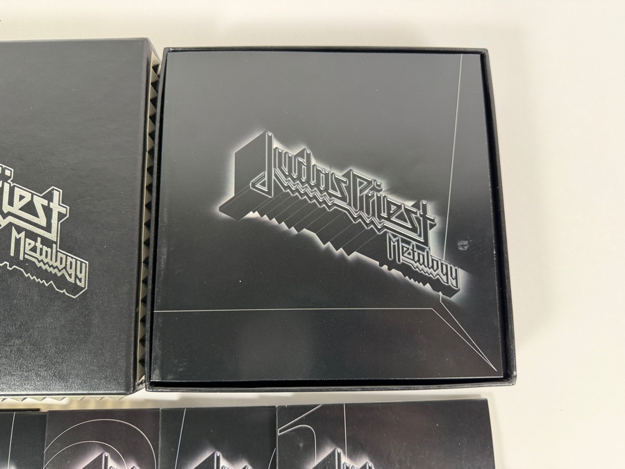 Judas Priest 'Metalogy' Limited Edition 5-Disc Box Set (4 CDs, 1 DVD, And 64-Page Retrospective Booklet) Featuring Black Faux-Leather Outer Slipcase Decorated With Triple-Row Pyramid Metal Stud Bound Edging [Photo 3]