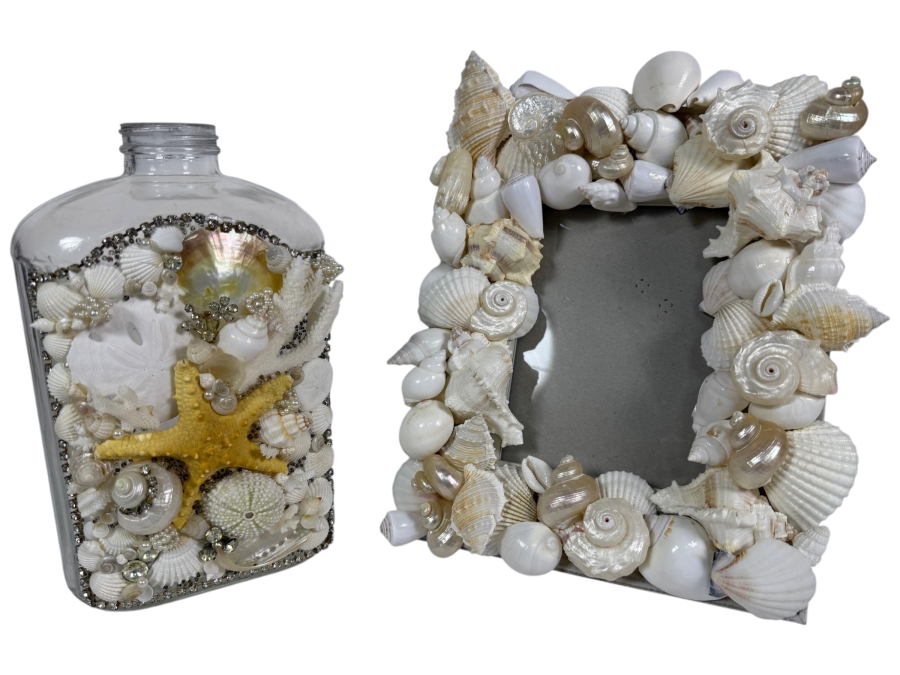 Handcrafted Coastal Elegance Mixed Shell Tabletop Set Featuring an Encrusted Decorative Glass Liquor Bottle and Coordinating White Shell Photo Frame 10'H and 12'H