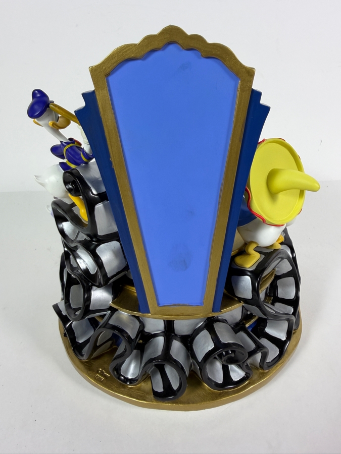 'Disney Donald Duck Through The Years' Musical Snow Globe Featuring Donald Duck in Various Outfits on a Rotating Filmstrip Base 9H [Photo 5]