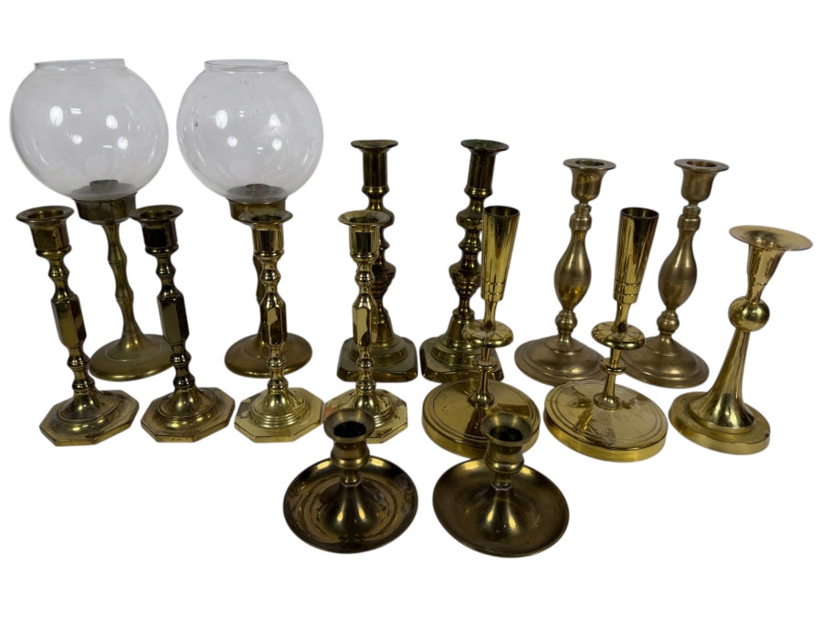 Collection Of Fourteen Vintage Cast Brass Candlesticks In Various Traditional Formats Including Hurricane Lamps
