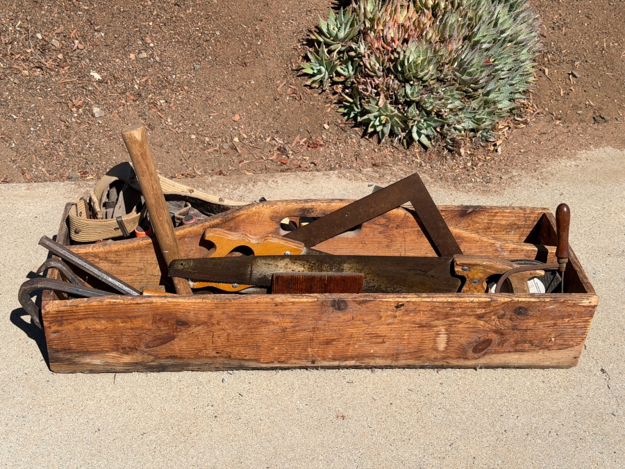Vintage Rustic Handmade Wooden Carpenters Tool Tote Box Caddy Filled With Assorted Hand Tools Including Saws Framing Square Pry Bars And Mallet
