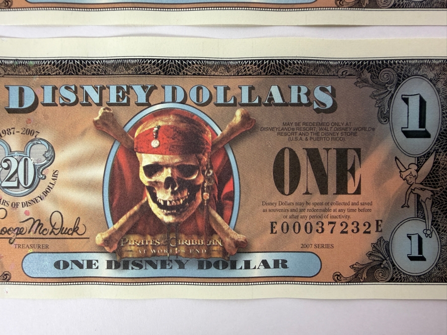 (2) 2007 Series $1 Disney Dollars Pirates of the Caribbean: At World's End Skull Design In Mint Uncirculated Condition Consecutive Serial Numbers E00037231E / E00037232E [Photo 3]