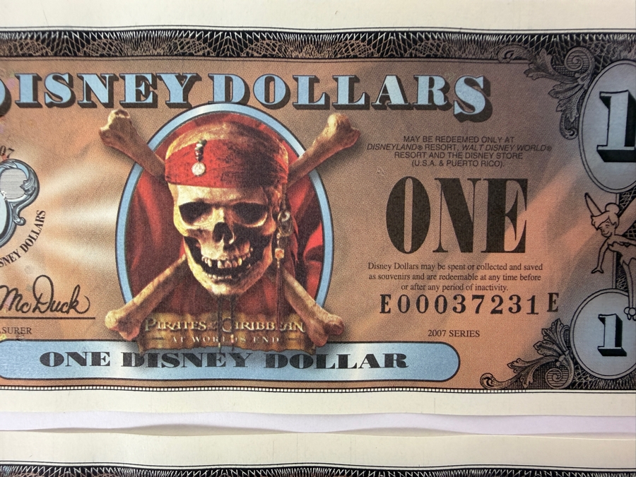 (2) 2007 Series $1 Disney Dollars Pirates of the Caribbean: At World's End Skull Design In Mint Uncirculated Condition Consecutive Serial Numbers E00037231E / E00037232E [Photo 2]