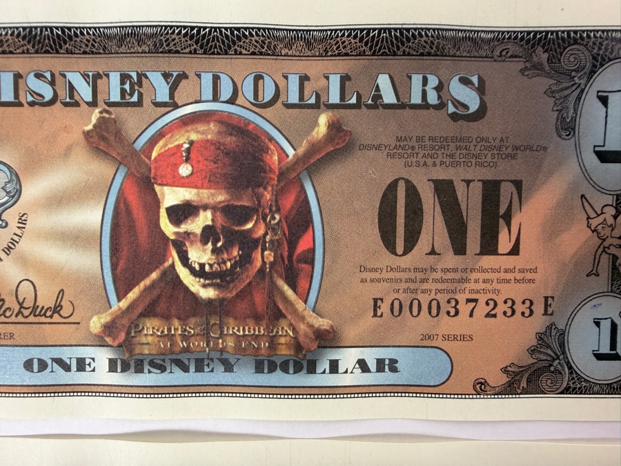 (2) 2007 Series $1 Disney Dollars Pirates of the Caribbean: At World's End Skull Design In Mint Uncirculated Condition Consecutive Serial Numbers E00037233E / E00037234E [Photo 2]