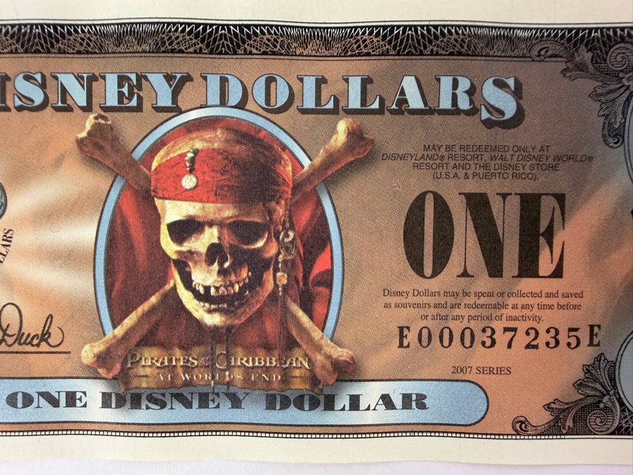 (2) 2007 Series $1 Disney Dollars Pirates of the Caribbean: At World's End Skull Design In Mint Uncirculated Condition Consecutive Serial Numbers E00037235E / E00037236E [Photo 2]