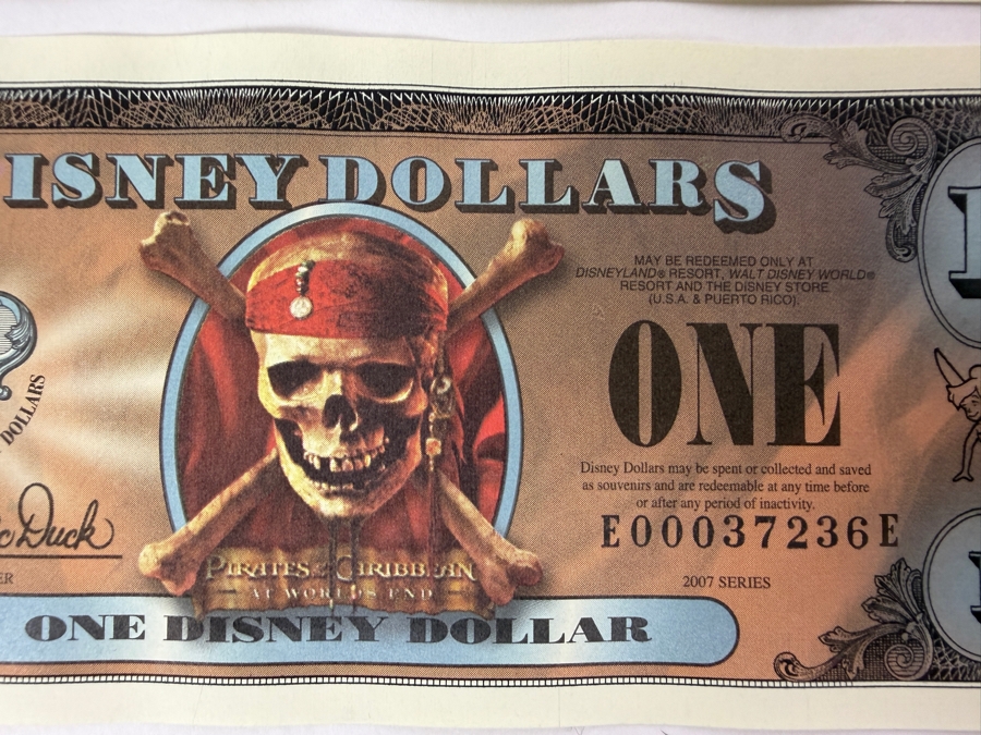 (2) 2007 Series $1 Disney Dollars Pirates of the Caribbean: At World's End Skull Design In Mint Uncirculated Condition Consecutive Serial Numbers E00037235E / E00037236E [Photo 3]