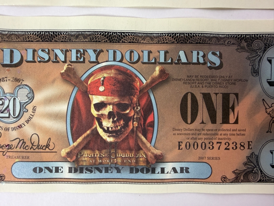 (2) 2007 Series $1 Disney Dollars Pirates of the Caribbean: At World's End Skull Design In Mint Uncirculated Condition Consecutive Serial Numbers E00037237E / E00037238E [Photo 3]