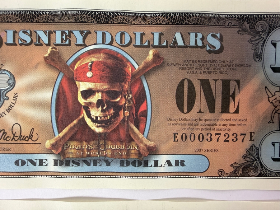 (2) 2007 Series $1 Disney Dollars Pirates of the Caribbean: At World's End Skull Design In Mint Uncirculated Condition Consecutive Serial Numbers E00037237E / E00037238E [Photo 2]