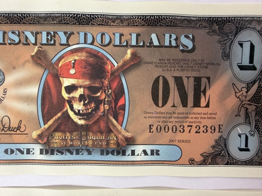 (2) 2007 Series $1 Disney Dollars Pirates of the Caribbean: At World's End Skull Design In Mint Uncirculated Condition Consecutive Serial Numbers E00037239E / E00037240E [Photo 2]