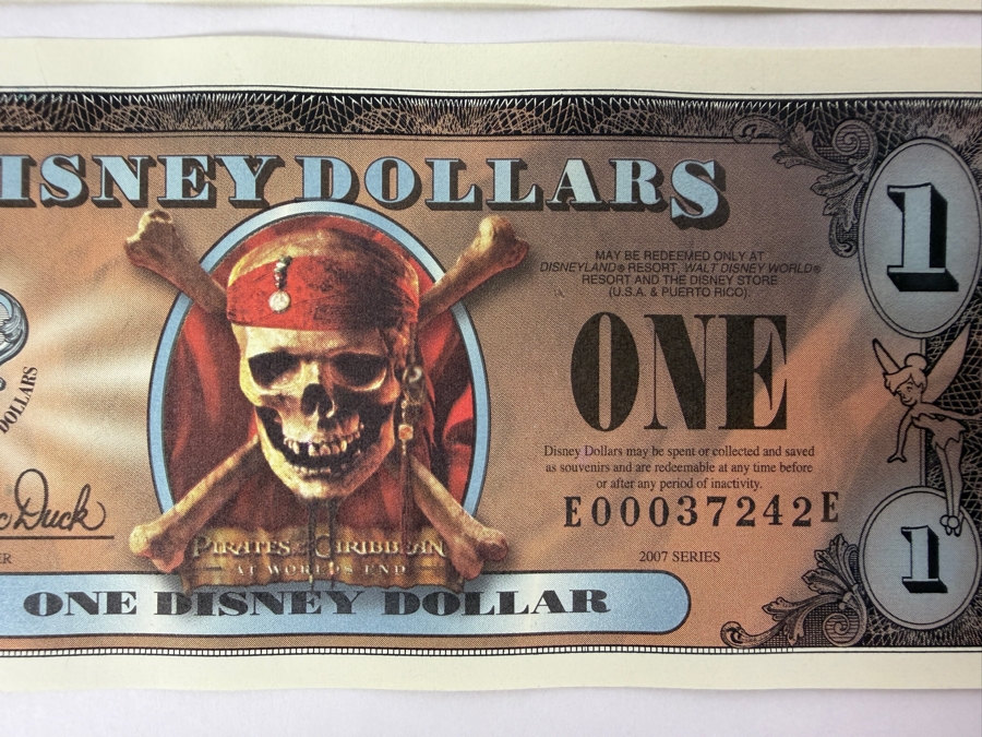 (2) 2007 Series $1 Disney Dollars Pirates of the Caribbean: At World's End Skull Design In Mint Uncirculated Condition Consecutive Serial Numbers E00037241E / E00037242E [Photo 3]