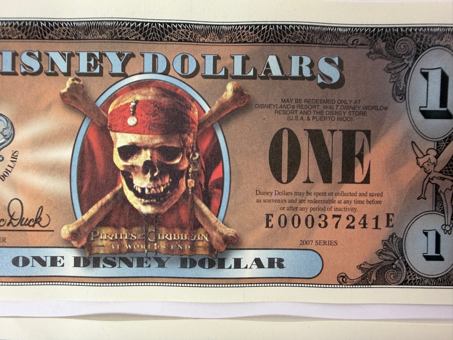 (2) 2007 Series $1 Disney Dollars Pirates of the Caribbean: At World's End Skull Design In Mint Uncirculated Condition Consecutive Serial Numbers E00037241E / E00037242E [Photo 2]
