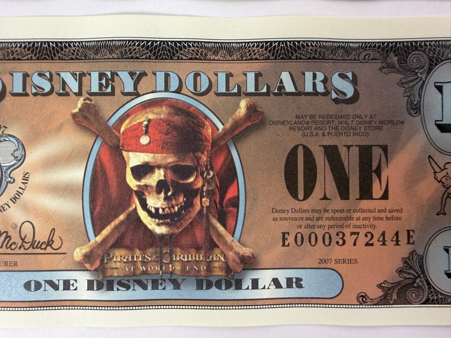 (2) 2007 Series $1 Disney Dollars Pirates of the Caribbean: At World's End Skull Design In Mint Uncirculated Condition Consecutive Serial Numbers E00037243E / E00037244E [Photo 3]
