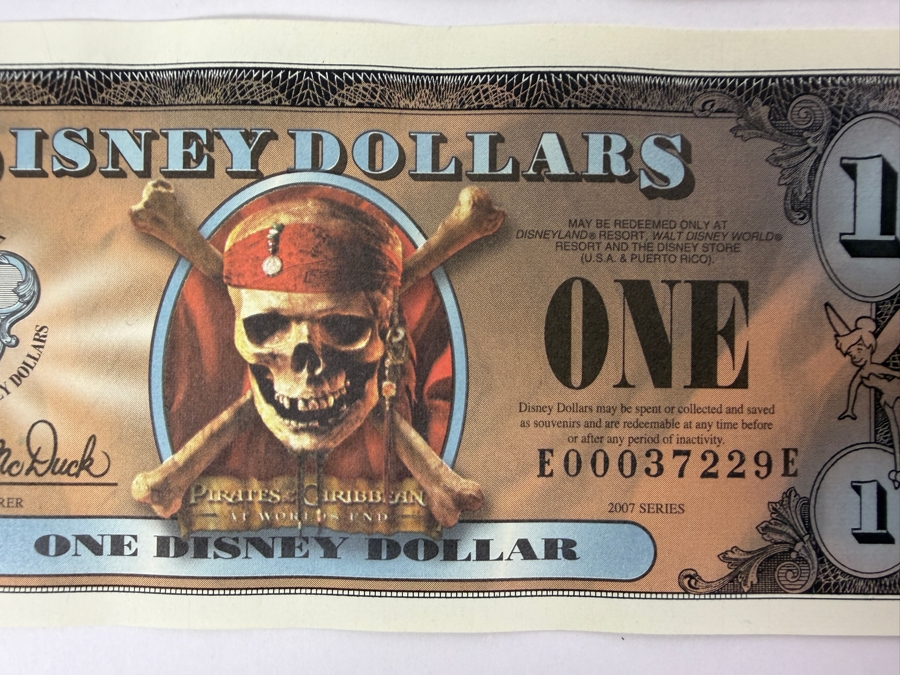 (2) 2007 Series $1 Disney Dollars Pirates of the Caribbean: At World's End Skull Design In Mint Uncirculated Condition Serial Numbers E00037226E / E00037229E [Photo 3]