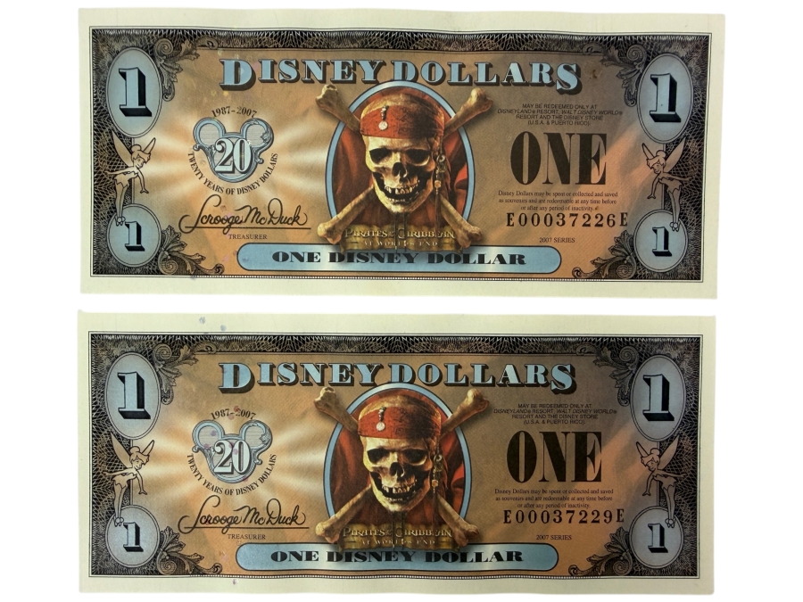 (2) 2007 Series $1 Disney Dollars Pirates of the Caribbean: At World's End Skull Design In Mint Uncirculated Condition Serial Numbers E00037226E / E00037229E