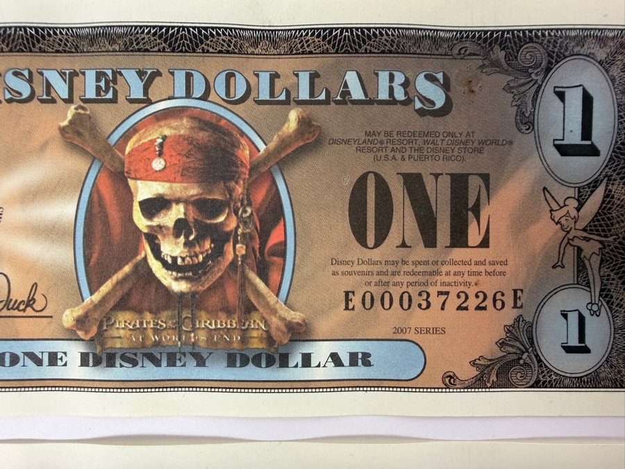 (2) 2007 Series $1 Disney Dollars Pirates of the Caribbean: At World's End Skull Design In Mint Uncirculated Condition Serial Numbers E00037226E / E00037229E [Photo 2]
