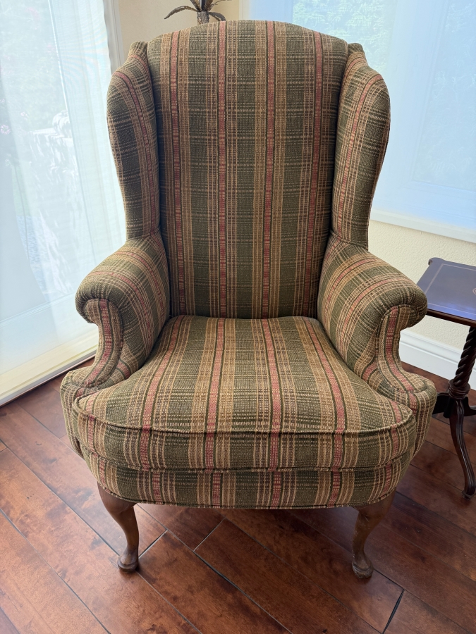 Traditional Queen Anne Style Upholstered Wingback Armchair Featuring Earth Tone Plaid Stripe Fabric And Carved Cabriole Legs 30'W X 32'D X 46'H