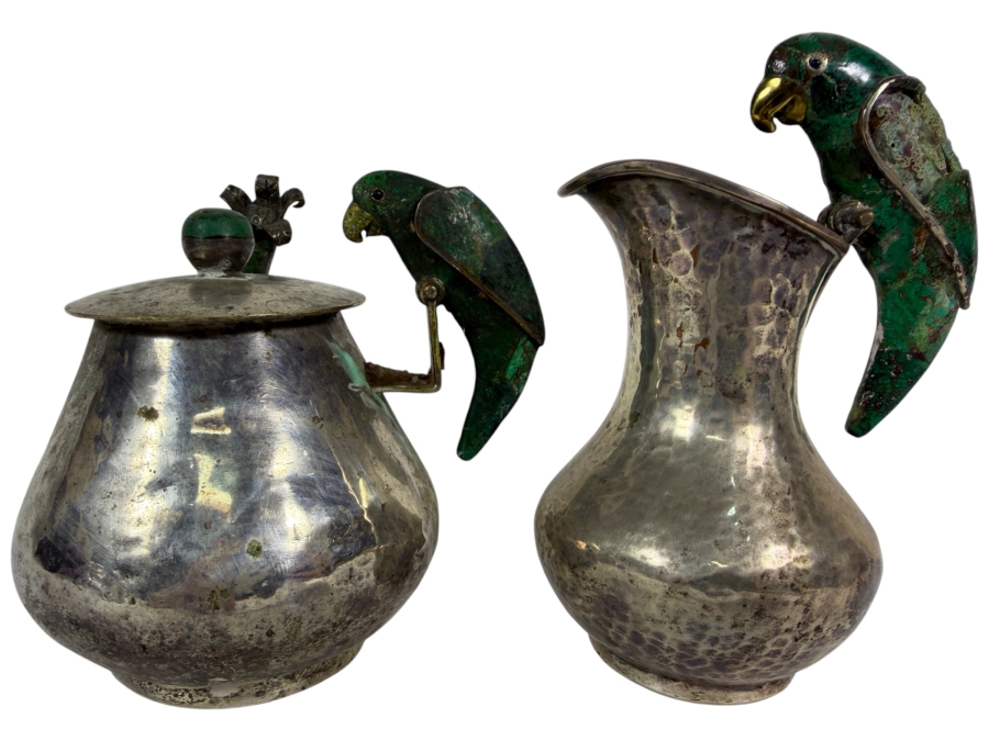 Emilia Castillo Hand Hammered Silver Plate Covered Sugar Bowl And Creamer (Inlaid Malachite on Wing of Parrot Needs Repair) Set Flanked By Malachite Inlaid Parrot Sculptures 5H