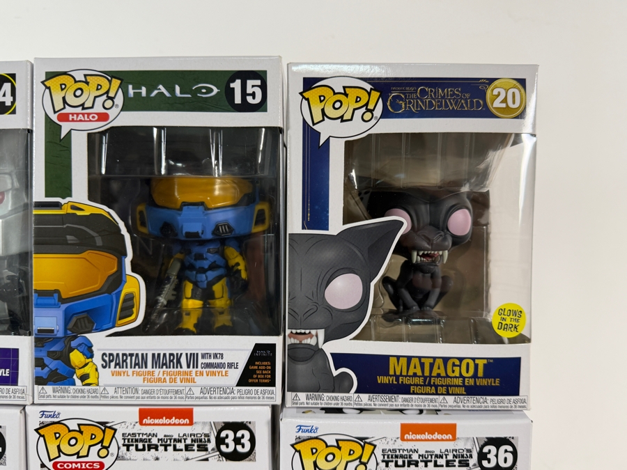 Lot Of 15 Assorted Funko Pop Vinyl Figures Including Teenage Mutant Ninja Turtles, Megatron, Halo, Rick And Morty, And Jingle All The Way, In Box. Estimate $185 - $265 [Photo 10]
