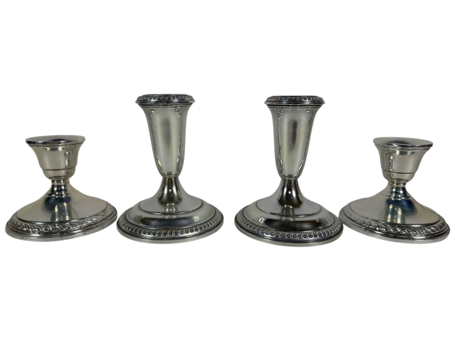 Four Piece Sterling Weighted Candlestick Collection Including One Pair Preisner And One Pair Empire With Gadroon Trim 3H 4H