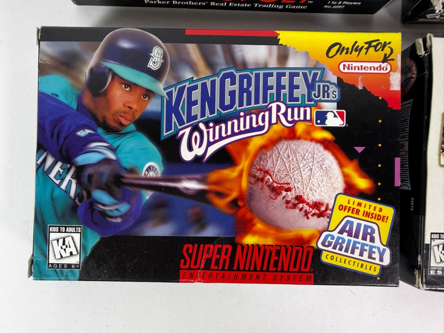 Lot Of 4 Assorted Vintage Super Nintendo Entertainment System SNES Games Complete In Box Including Monopoly, Battle Grand Prix, Ken Griffey Jr., And Brunswick Bowling. Estimate $95 - $155 [Photo 2]