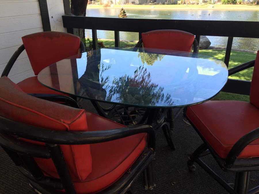 Outdoor Black Rattan Glass Top Table With Four Chairs On Casters [Photo 6]