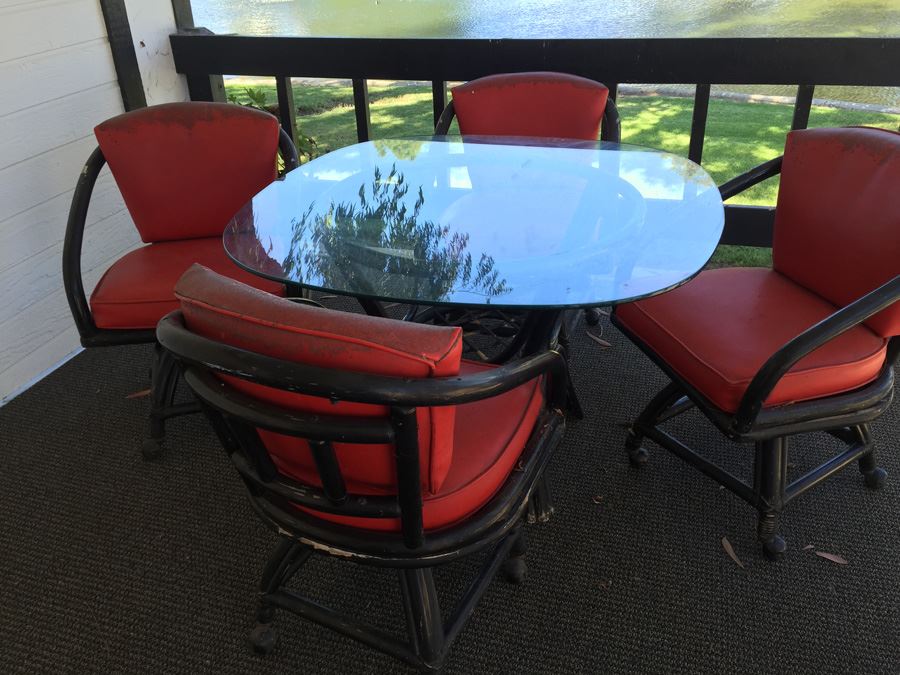 Outdoor Black Rattan Glass Top Table With Four Chairs On Casters [Photo 9]